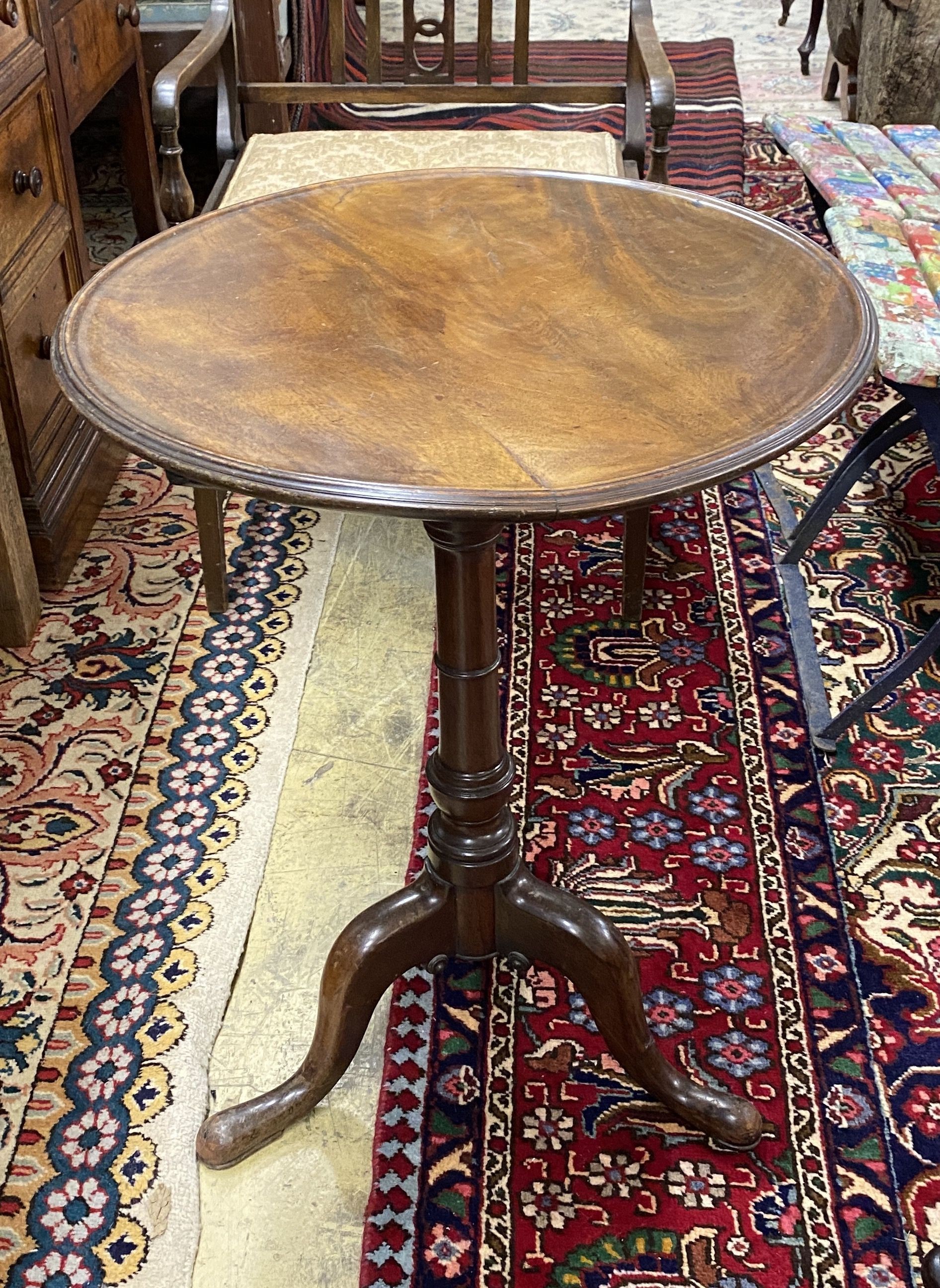 A Georgian mahogany circular tilt top tripod table with dished top, diameter 54cm, height 70cm together with an Edwardian piano stool